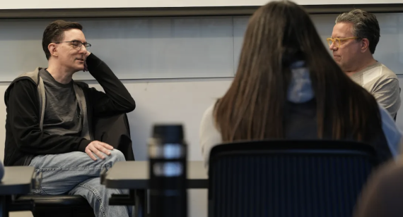 Two men talking to one another.