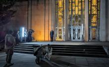 People on building steps at night