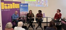 Four people sit in discussion.