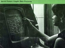 A woman touching an electronic screen.