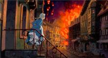 Woman looking out onto burning street