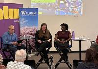 Four people sit in discussion.