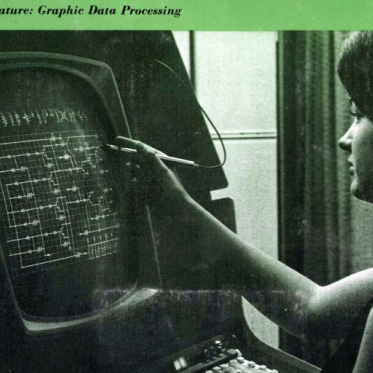 A woman touching an electronic screen.
