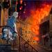 Woman looking out onto burning street
